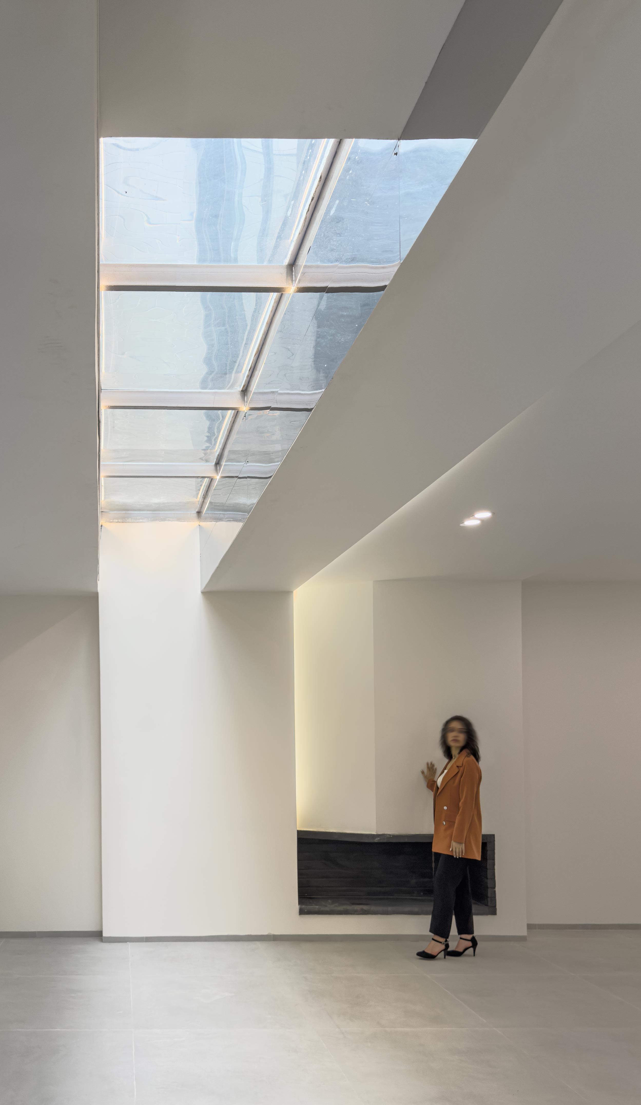 A shallow glass-bottomed pool and the tv room, Penthouse, Penthouse at the Jameh-Chin (Pleated Veil) Apartment