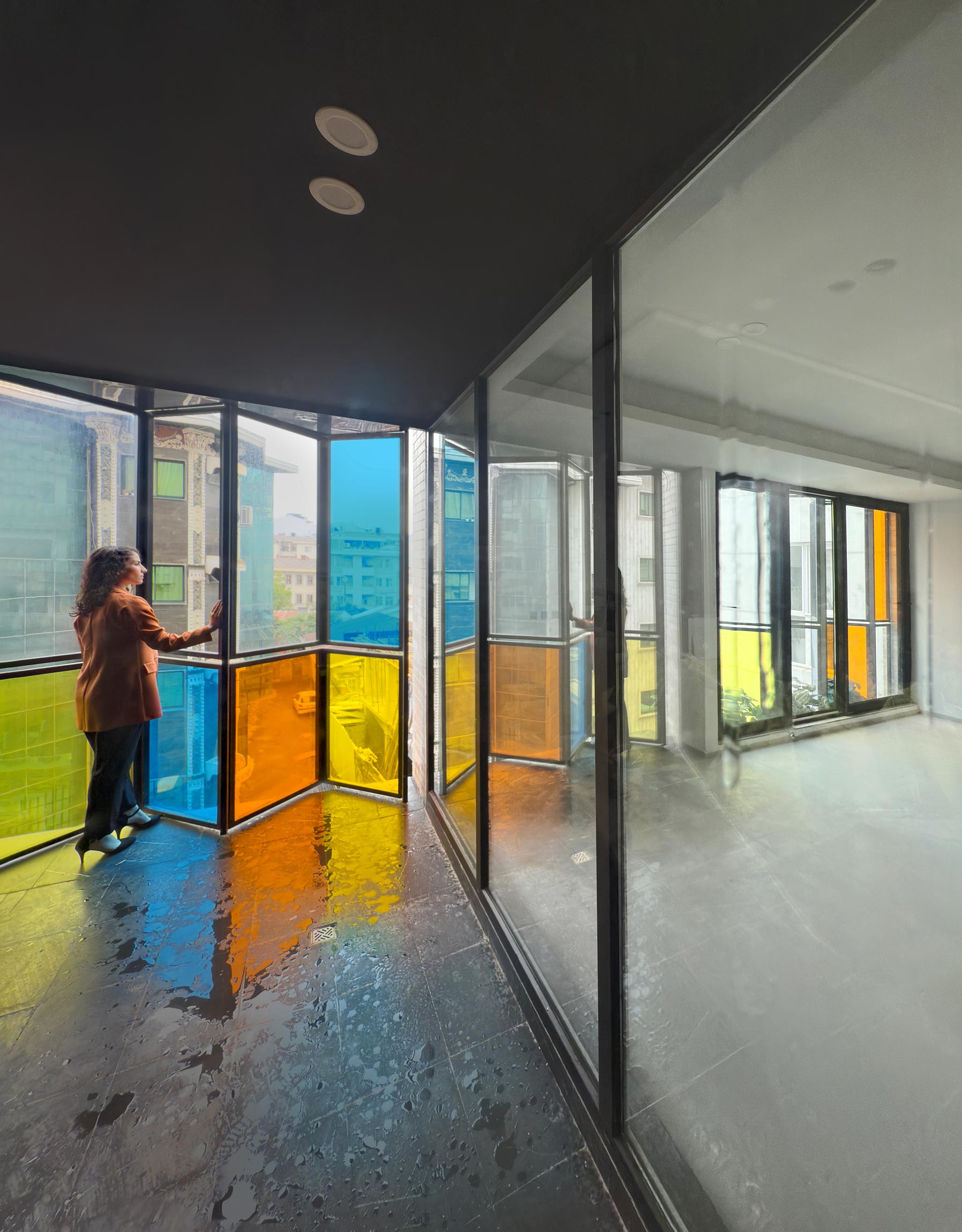 a person on the main balcony, the 3rd and 4th floor, the Jameh-Chin (Pleated Veil) Apartment,100 St, Rasht, Iran